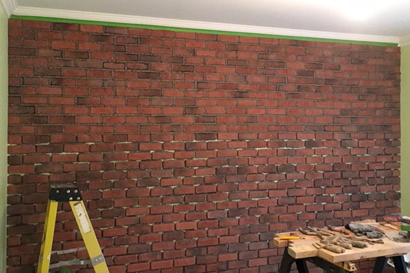 Installation-de-pierres-et-briques-collees-1